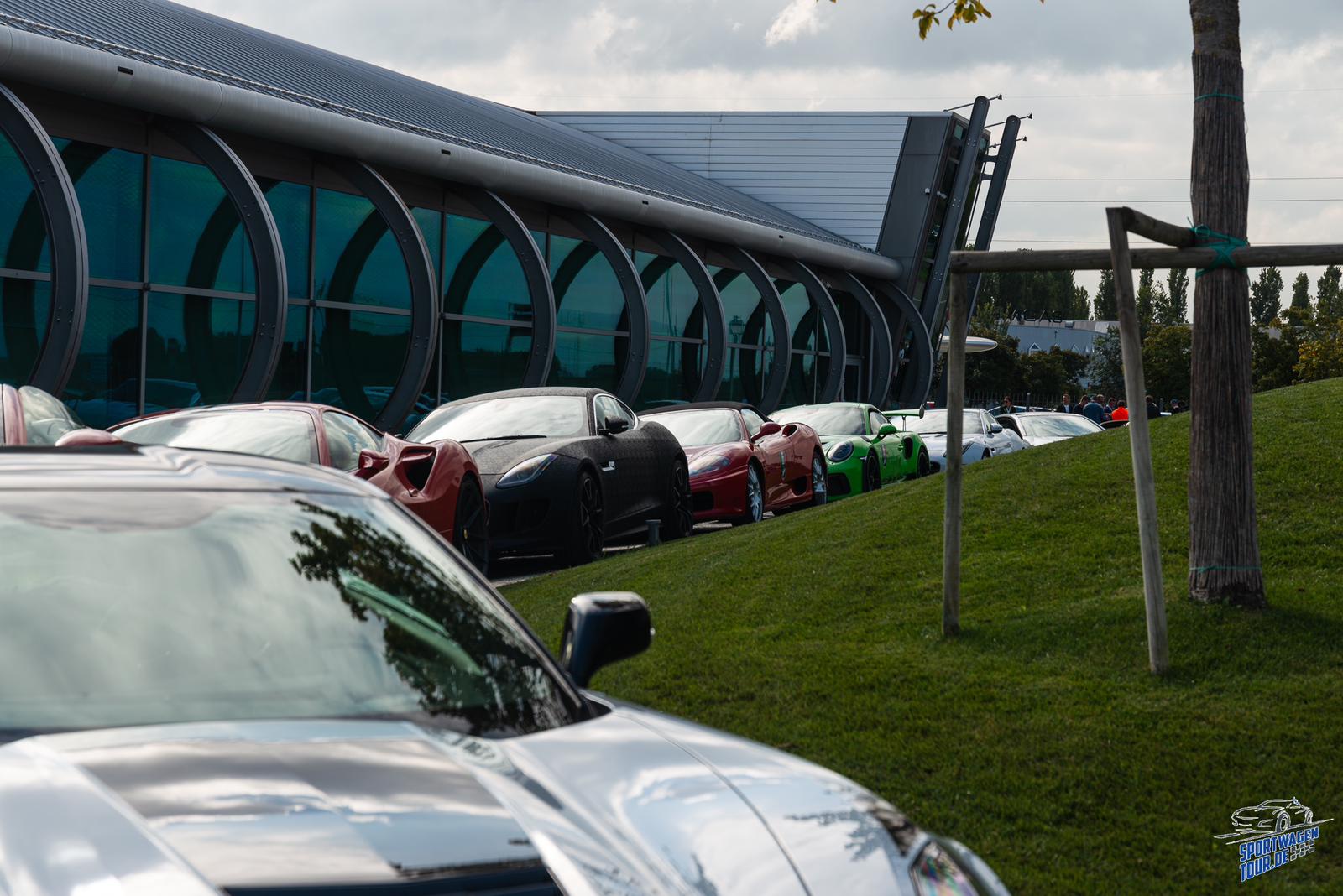 LagoRun sports cars parked outside the Pagani building